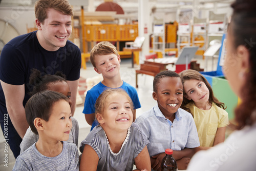 Teacher and kids having fun at a science centre