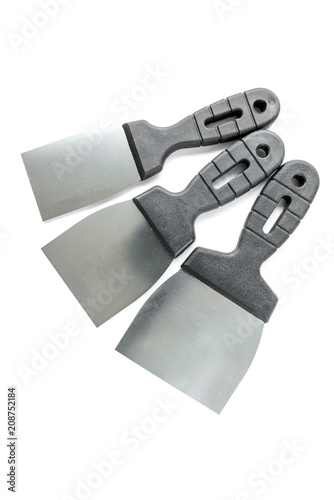 Putty knives isolated on white background. Spatula repair tool. Spackling or paint instruments.