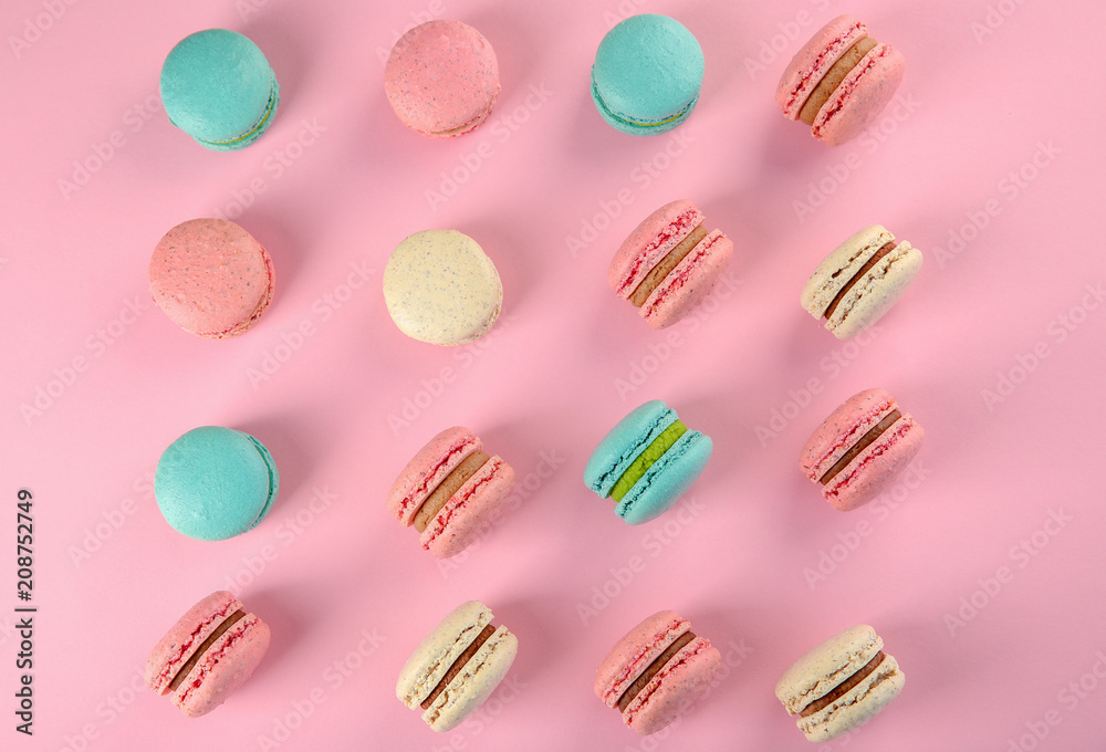 Delicious macarons on color background, flat lay Delicious macarons on color background, flat lay