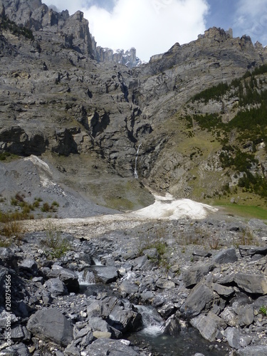 Rugged mountain scenery in the Gasterntal valley, near Kandersteg, Switzerland, with mountain stream and rocks in the foreground