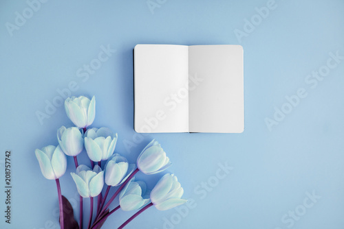 Notebook and flowers photo