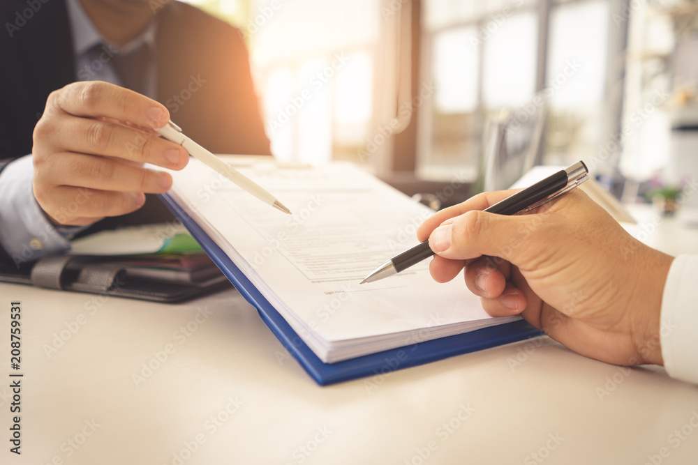 Hands are signing contract agreement.Contract agreement policy concept. Hands are signing contract agreement.Contract agreement policy concept.