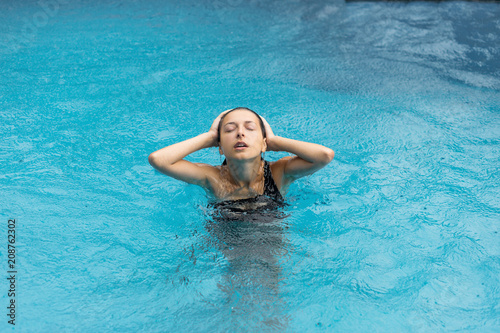 Wet woman in pool © Kate
