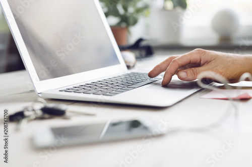 Person using laptop in office