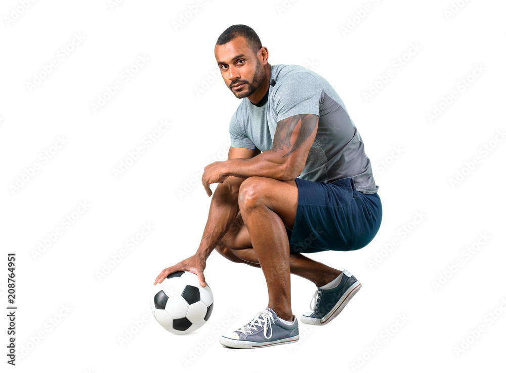 Strong football player with soccer ball on isolated white background Strong football player with soccer ball on isolated white background