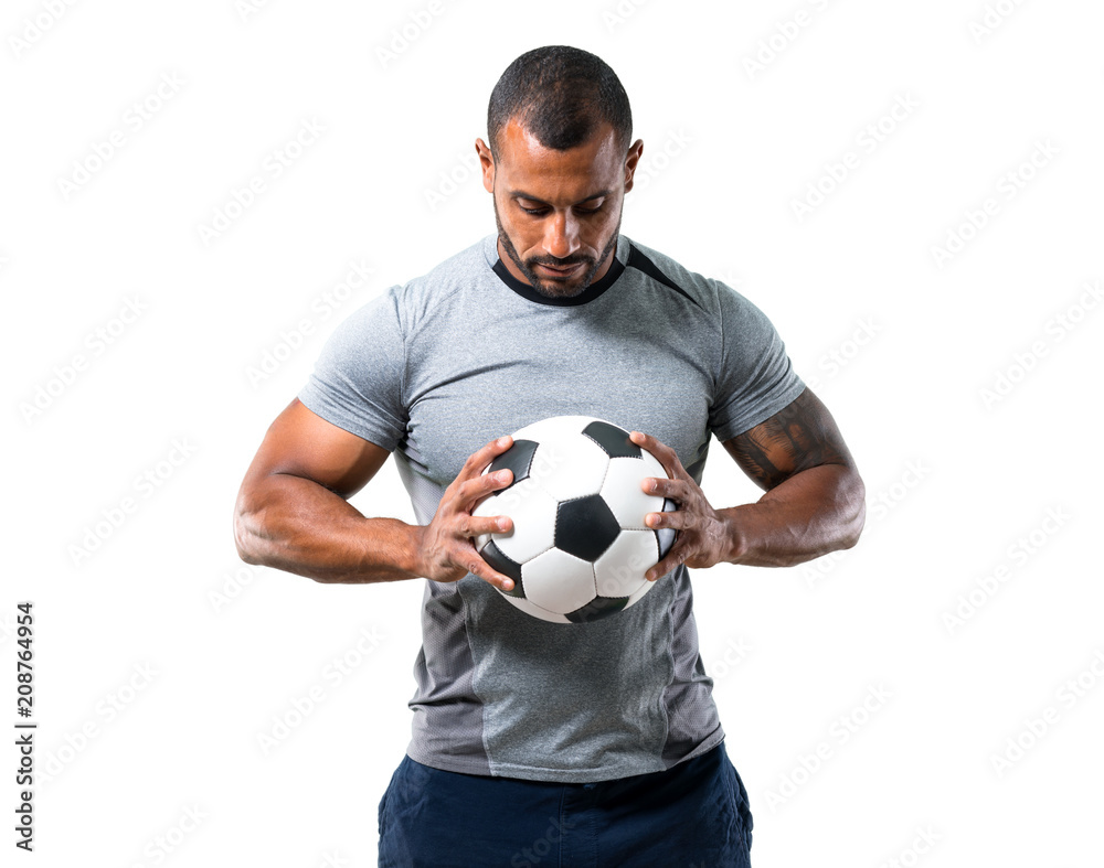 Strong football player with soccer ball on isolated white background Strong football player with soccer ball on isolated white background