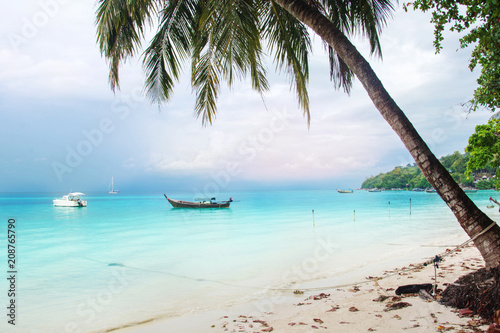 Landscape With Coconut Palms And Boat In Blue Sea Southern Of Thailand, Lipe Island, Krabi.