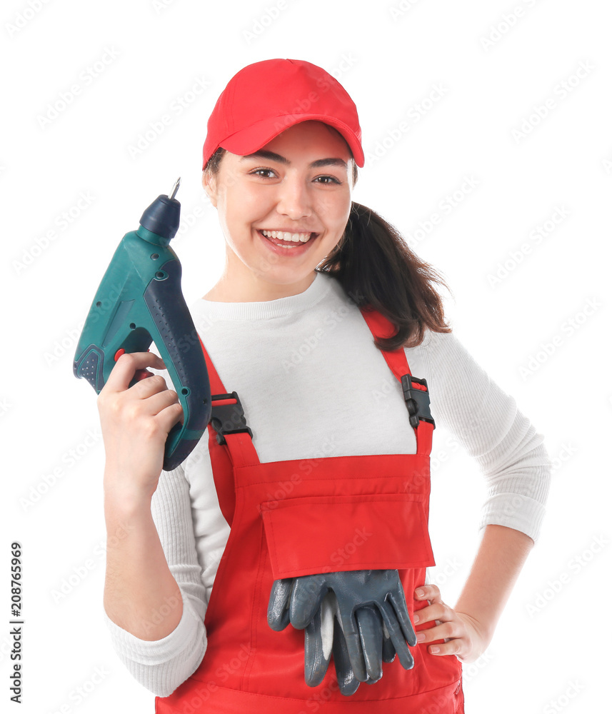 Female mechanic in uniform with drill on white background Female mechanic in uniform with drill on white background