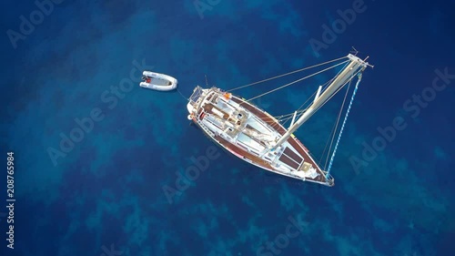 Yacht sailing at windy day. Freedom of Yachting at opened sea / ocean. Aerial, drone video.