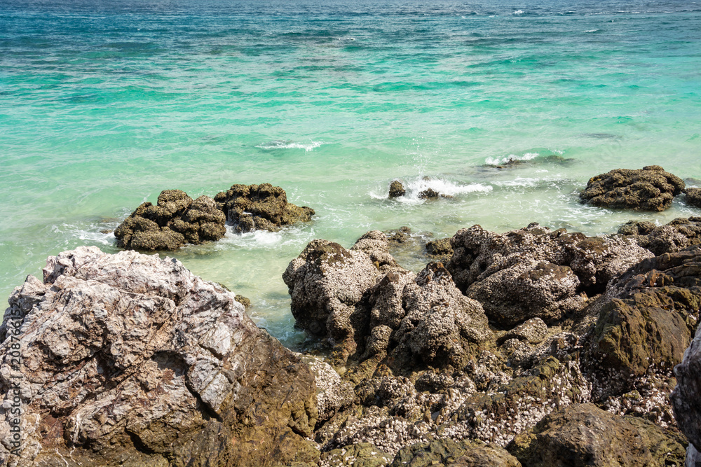 Stone In Green Sea With Wave Stone In Green Sea With Wave