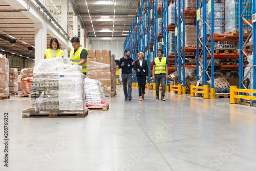 Young quality inspector checking warehouse