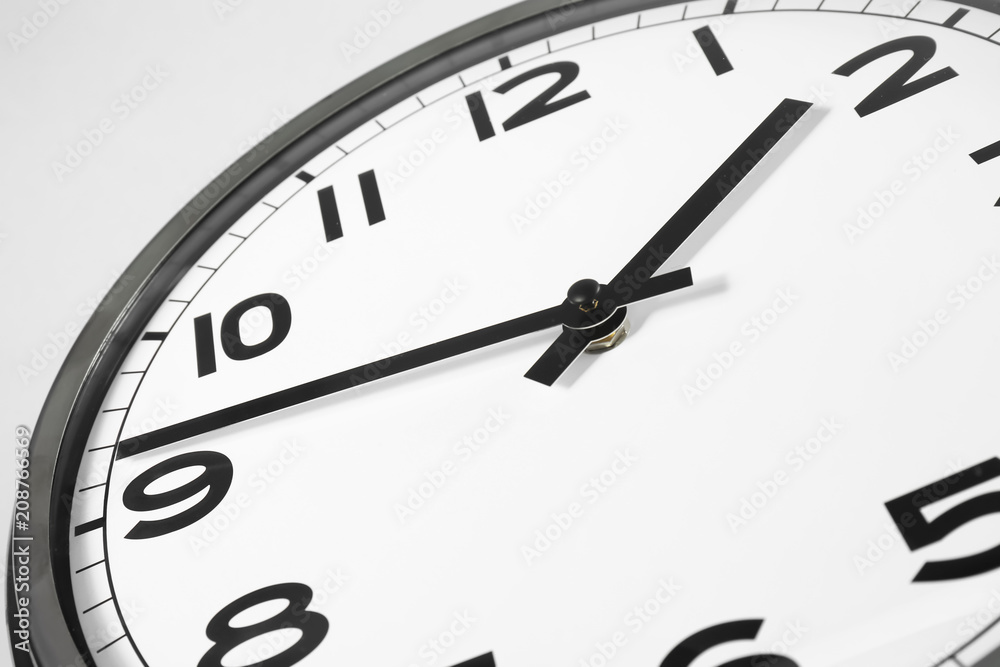 Clock on light background, closeup. Time management concept Clock on light background, closeup. Time management concept