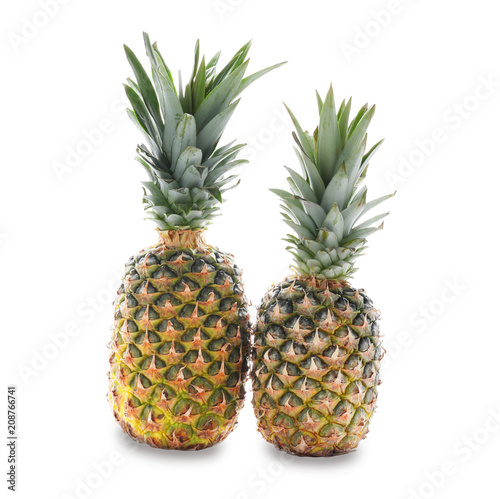 Tasty pineapples on white background © Pixel-Shot