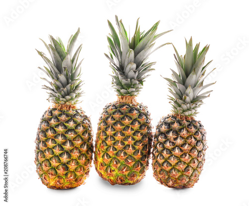 Tasty pineapples on white background © Pixel-Shot