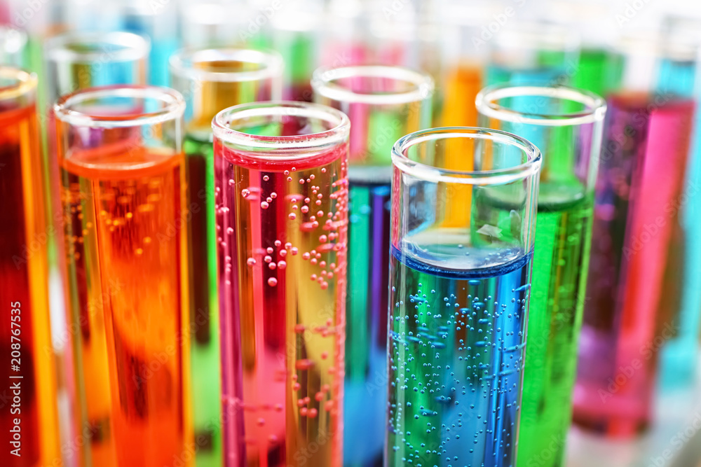 Many test tubes with colorful liquids, closeup - obrazy, fototapety, plakaty 