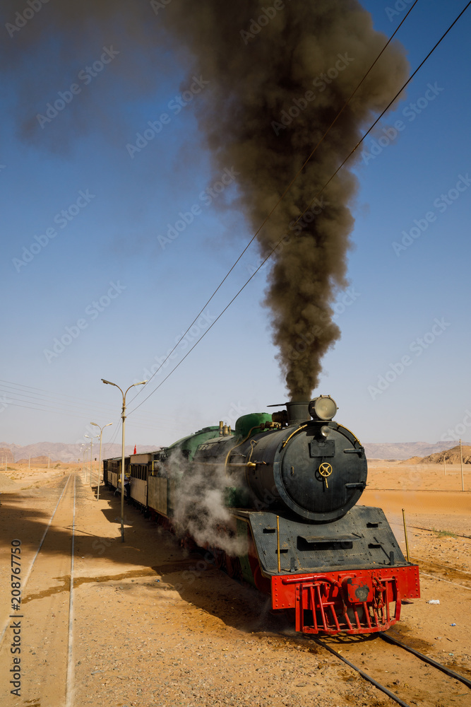 Fototapeta premium Steam locomotive in the desert of Wadi Rum in Jordan