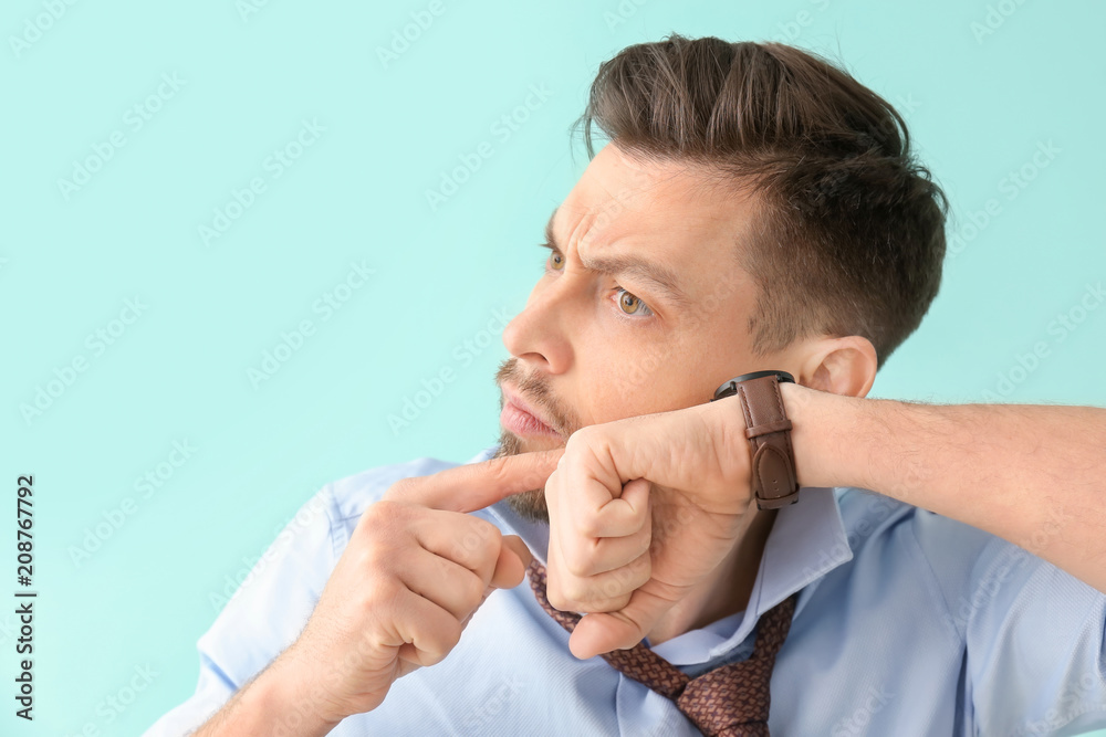 Man with wristwatch on color background. Time management concept Man with wristwatch on color background. Time management concept