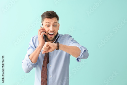 Businessman with wristwatch...