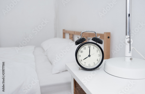 Close up clock with bedroom background