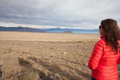 Woman on right looking back left into vast Patagonia landscape