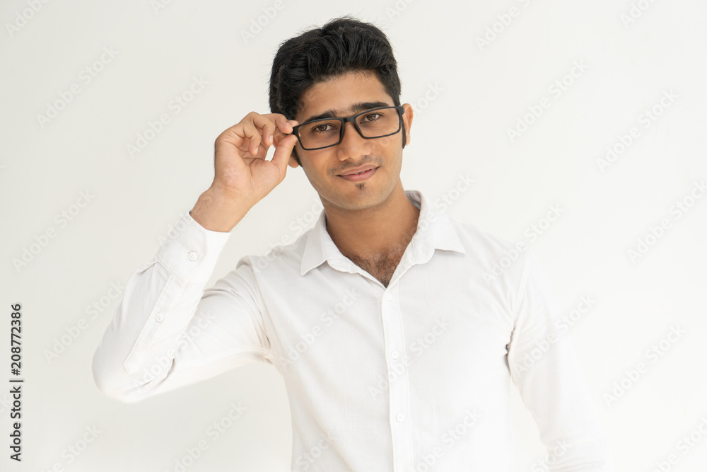 Pensive smiling Indian guy wearing glasses. Handsome stylish young man ...