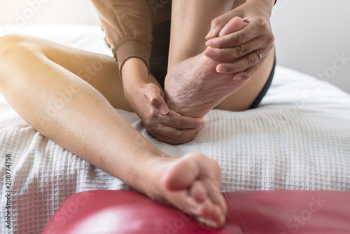 Close up of woman having a heel or foot sole pain,Female feeling exhausted and painful