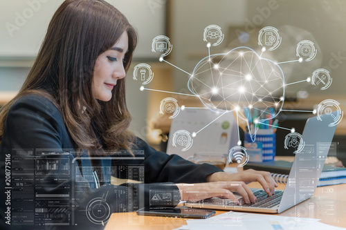Asian businesswoman in formal suit working with computer laptop for Polygonal brain shape of an artificial intelligence with various icon of smart city Internet of Things, AI and business IOT concept photo