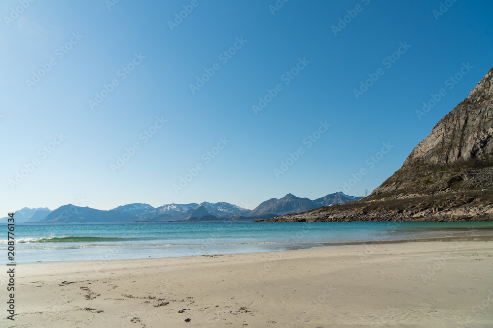 Waves at Rorvikstranda beach and Gimsoystraumen fjord near Henningsvaer at Lofoten Islands / Norway Waves at Rorvikstranda beach and Gimsoystraumen fjord near Henningsvaer at Lofoten Islands / Norway