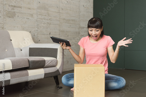 woman unboxing at home