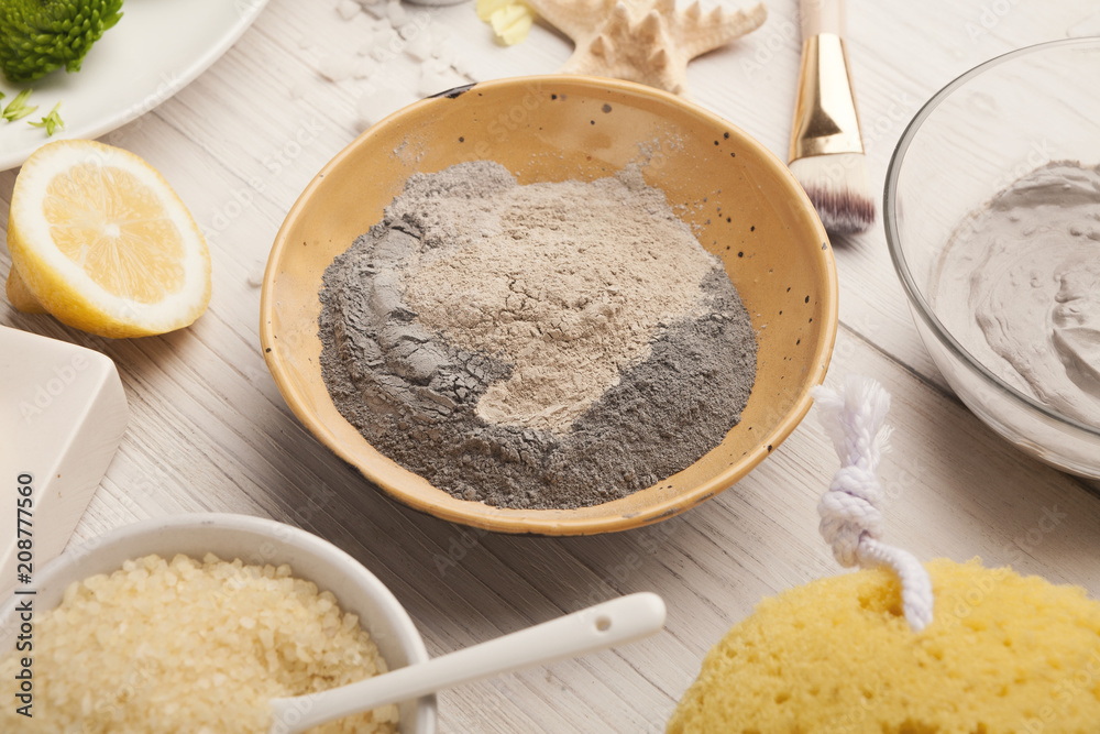 Mud mask emultion on white wooden table Mud mask emultion on white wooden table