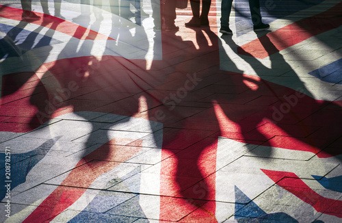 Fényképezés Shadows of People and UK Flag Citizens of Great Britain