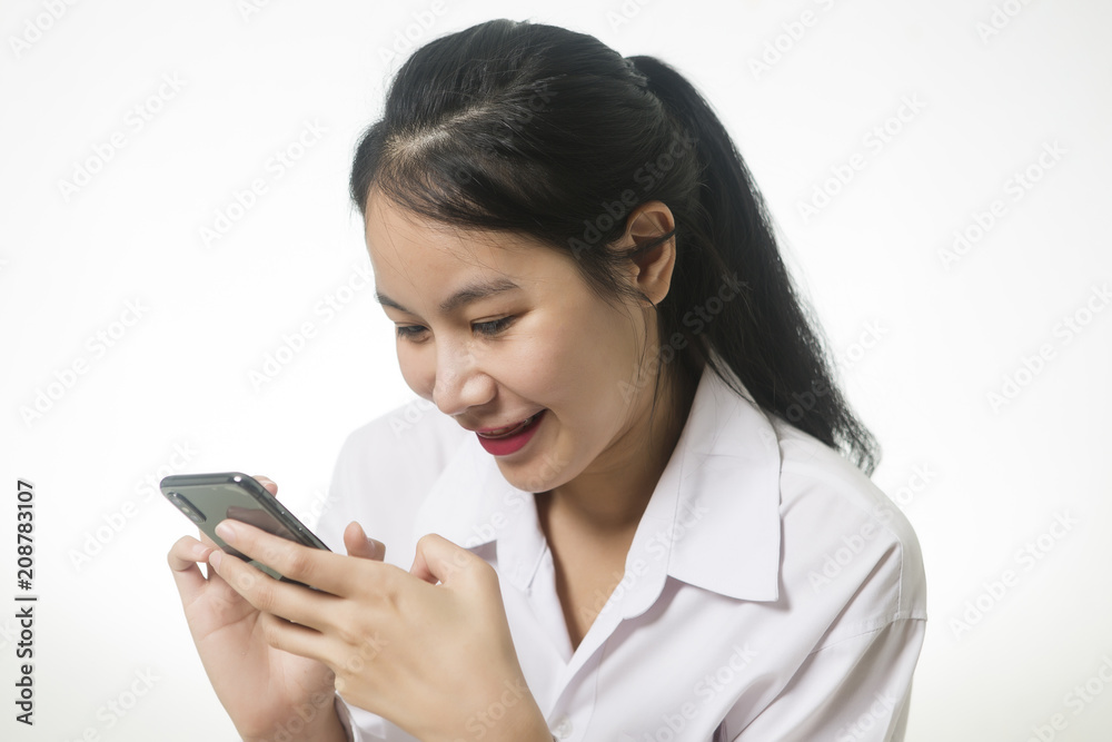 Portrait of attractive young woman happy and smile while using smartphone Portrait of attractive young woman happy and smile while using smartphone