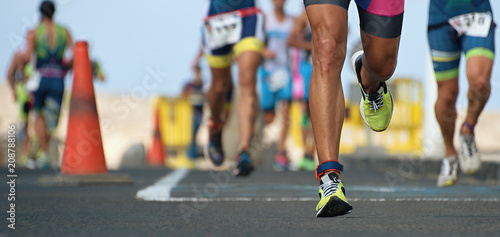 Marathon running race  runners feet on road