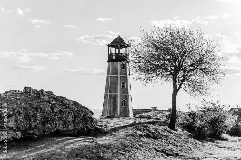 Dramatic seascape with old lighthouse. monochrome Dramatic seascape with old lighthouse. monochrome