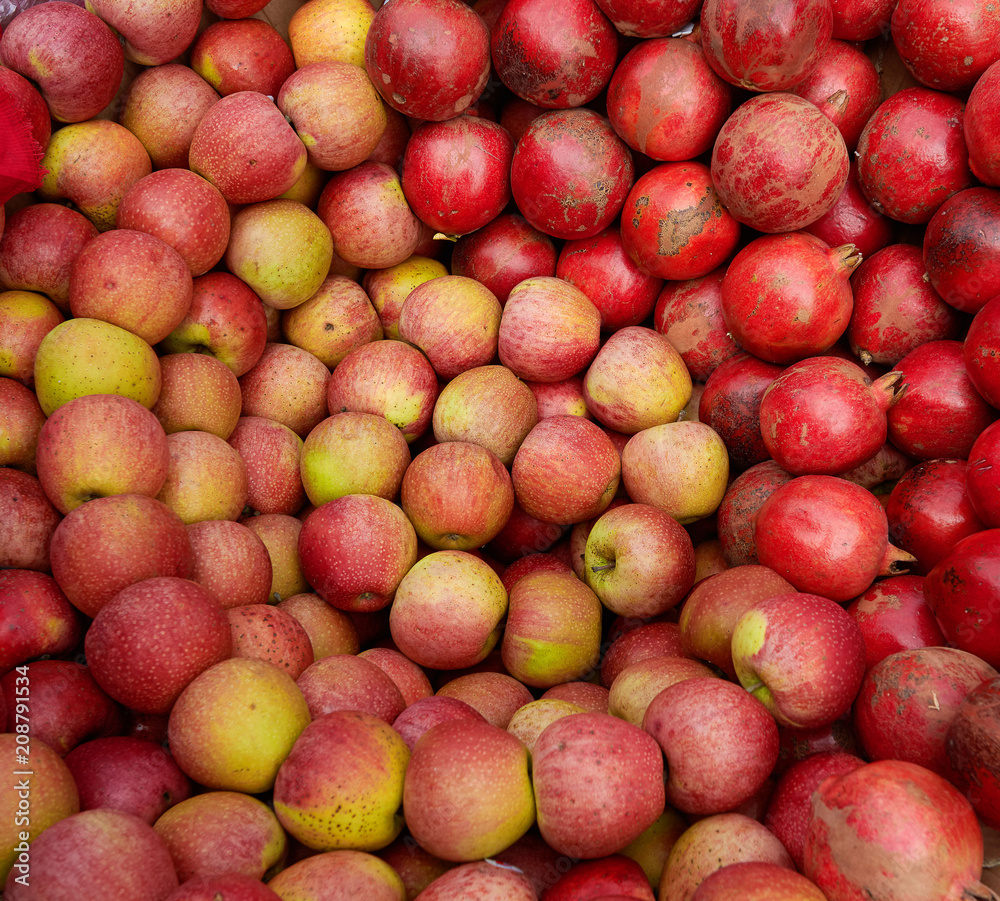 Red apples and pomegranate placed as a circuit Red apples and pomegranate placed as a circuit