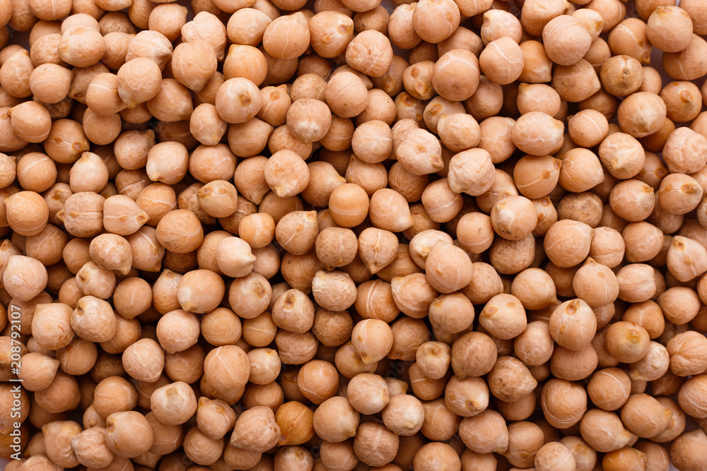 uncooked chickpeas on a white acrylic background uncooked chickpeas on a white acrylic background