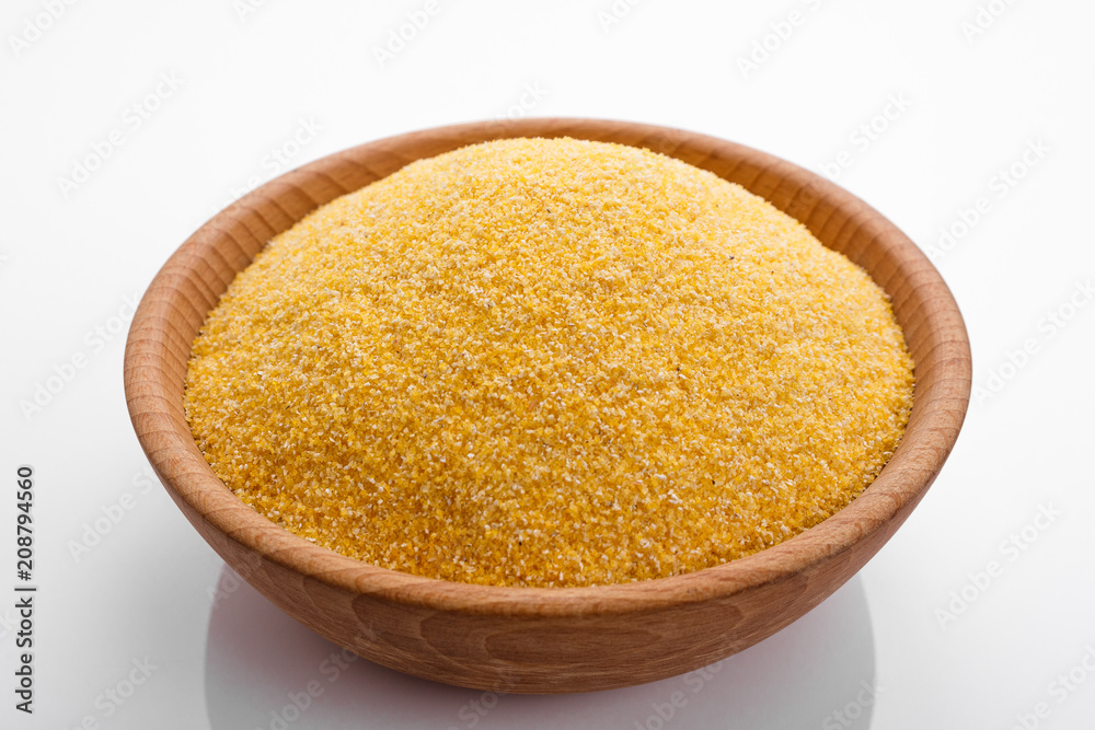 raw Italian corn porridge polenta on a white background