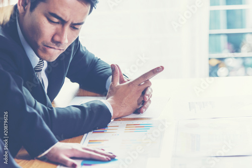 Business adviser analyzing ...