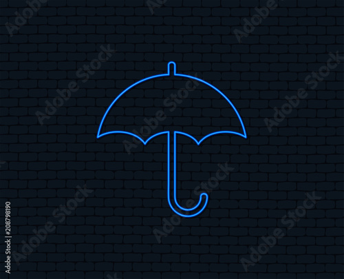Neon light. Umbrella sign icon. Rain protection symbol. Glowing graphic design. Brick wall. Vector