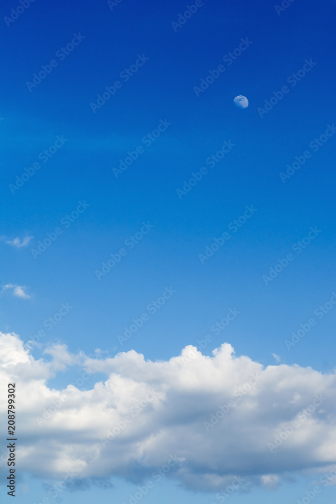 Blue sky with clouds and moon background