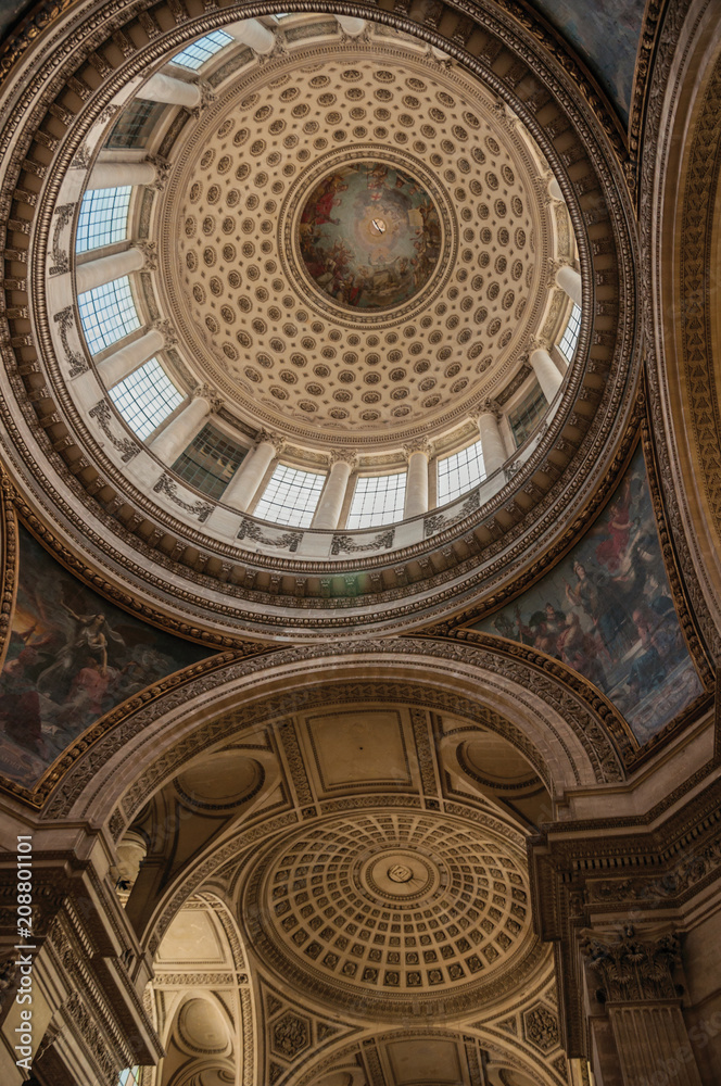 Inside view of the colorful and richly decorated Pantheon dome and ceiling in Paris. Known as one of the most impressive world’s cultural center. Northern France.