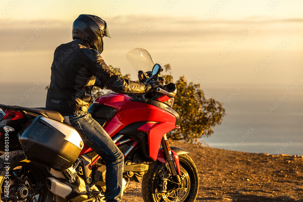 Man at Pacific Coast on Motorcycle