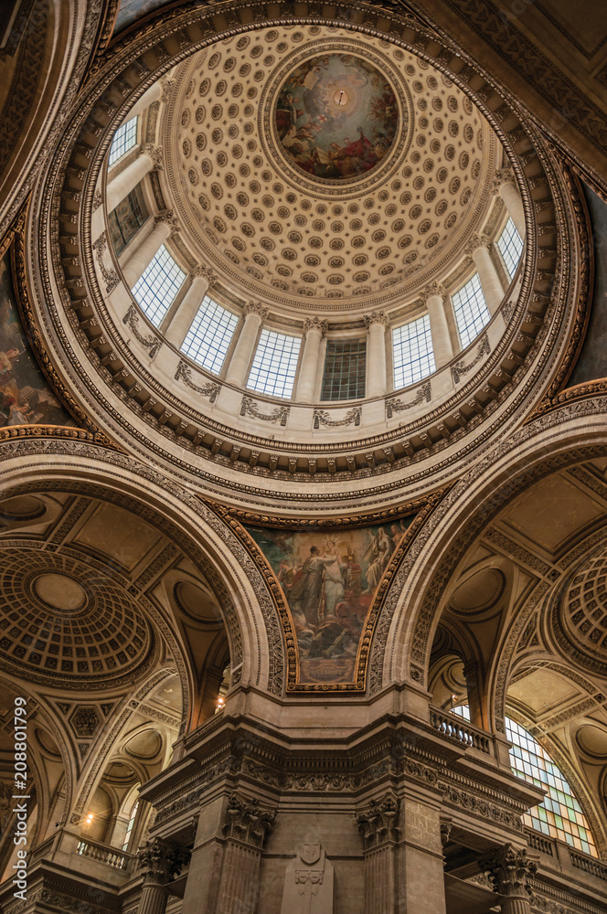 Inside view of the colorful and richly decorated Pantheon dome and ceiling in Paris. Known as one of the most impressive world’s cultural center. Northern France.