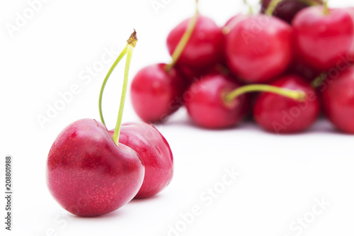 natural red cherries isolated in white background