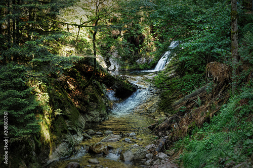 Scenic countryside landscape in the Black Forest: hiking through green forest with amazing views in spring near Allerheiligen, Germany