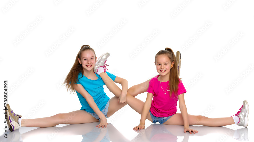 Girls gymnasts warm up. Girls gymnasts warm up.