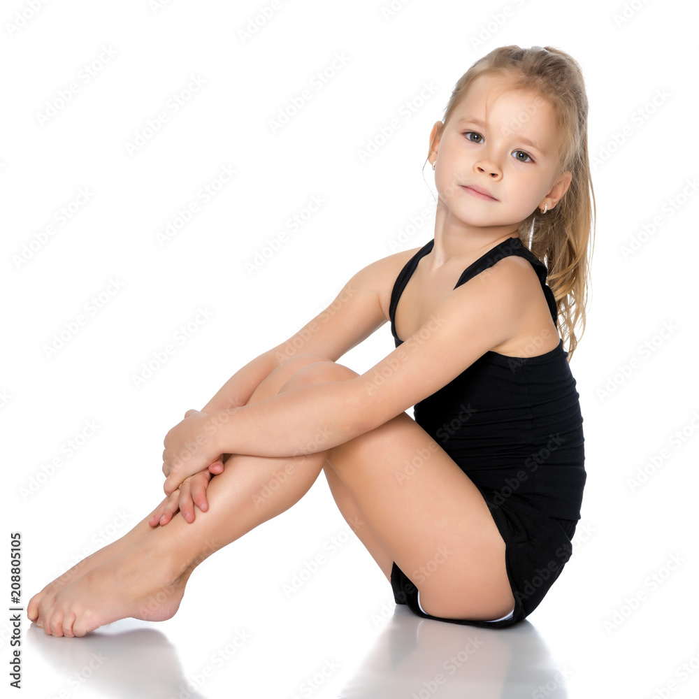 The gymnast prepares to perform the exercise. The gymnast prepares to perform the exercise.