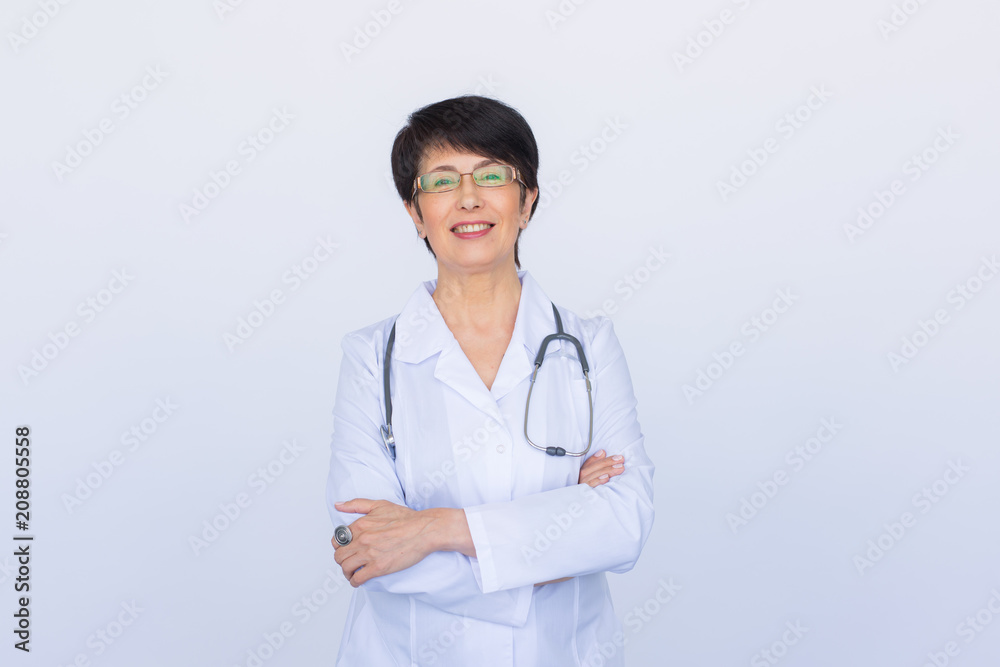 Portrait of attractive female doctor over white background Portrait of attractive female doctor over white background