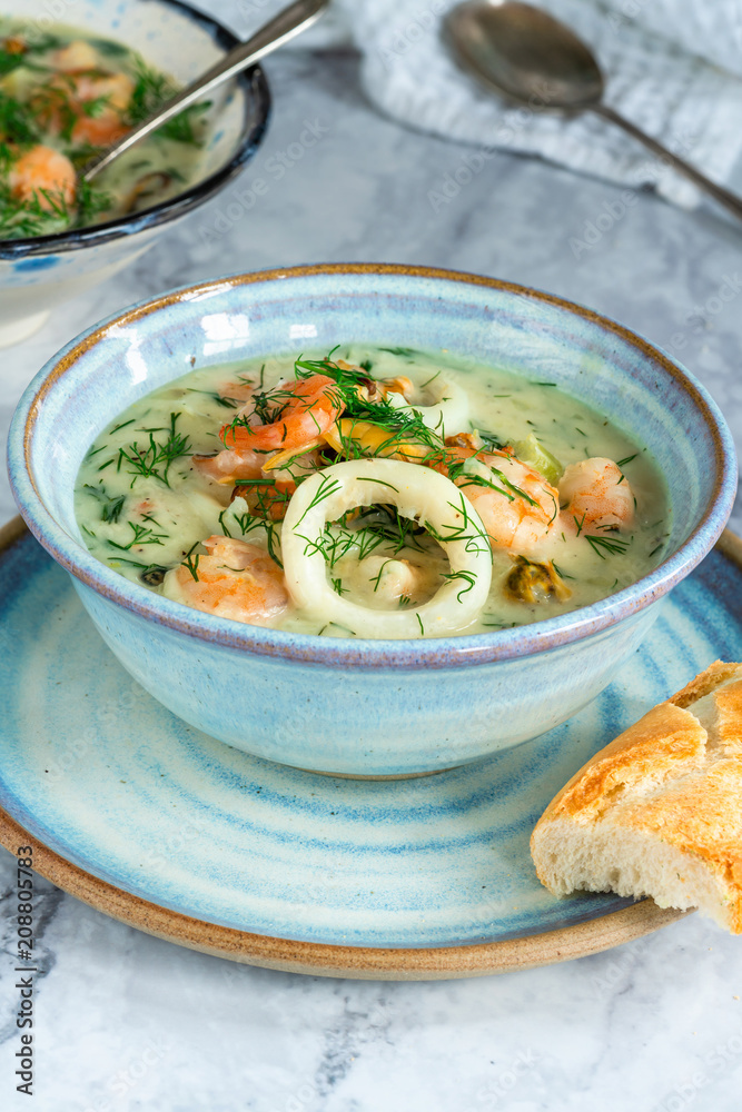 Creamy seafood stew garnished with fresh dill Creamy seafood stew garnished with fresh dill