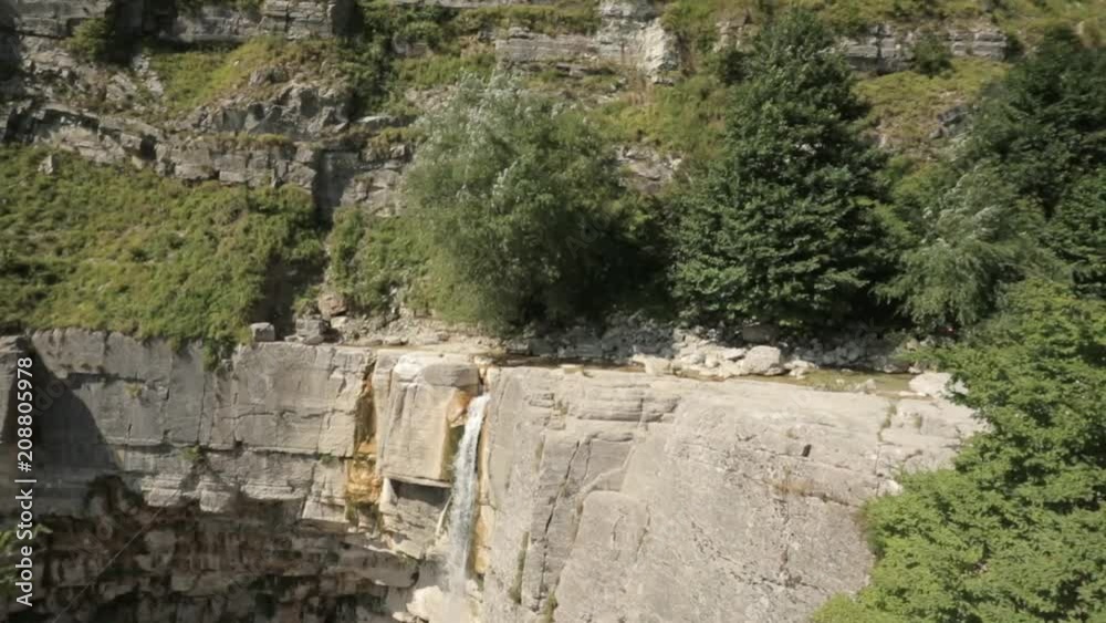 Kinchkha Waterfall, Kinchkhaferdi Road, Kinchkhaperdi. Okatse - Kinchkha Waterfall Natural Monument Near Kutaisi In Imereti Region In Georgia. Famous Natural Landmark In Sunny Summer Day Kinchkha Waterfall, Kinchkhaferdi Road, Kinchkhaperdi. Okatse - Kinchkha Waterfall Natural Monument Near Kutaisi In Imereti Region In Georgia. Famous Natural Landmark In Sunny Summer Day